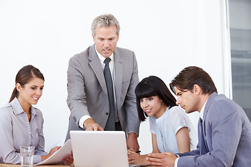 Image showing Teamwork, coaching and laptop with business people in office for planning, idea and project management. Training, consulting and technology with ceo and employees for mentor, leadership and meeting