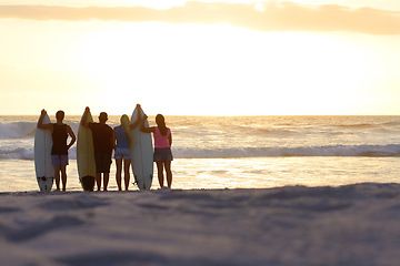 Image showing Surfer group, silhouette and sunset with space for mockup at beach for freedom, youth and nature. People, women and men outdoor by ocean, sunshine or waves in summer, holiday and relax with surfboard