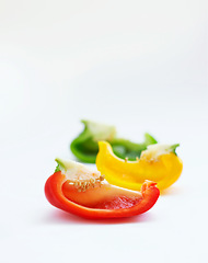 Image showing Vegetables or fruits, bell peppers and in studio or white background. Closeup nutrition or diet, vegetarian and salad meal with different colors for health or food commercial or advertisement