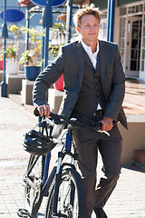 Image showing Bike, travel and business man in city for morning, commute and carbon neutral transportation. Sustainability, cycling and health with male employee and bicycle for journey, eco friendly and relax