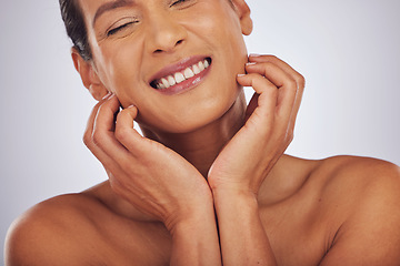 Image showing Self care, dermatology and mature woman with skincare, makeup and aesthetic on a studio background. Female person, face or model with luxury cosmetics, natural beauty or wellness with a glow or smile