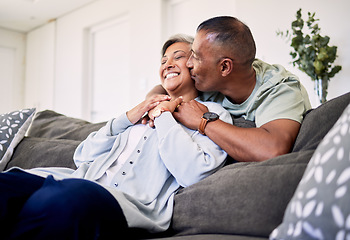 Image showing Hug, surprise kiss and happy elderly couple bonding, relax and spending time together, smile and enjoy home retirement. Living room, love or senior man, old woman or sweet people with marriage care