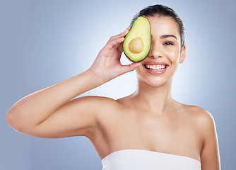 Image showing Avocado, skincare and portrait of latino woman in studio happy with detox, wellness or omega 3 treatment on grey background. Fruit, face and lady model smile for anti aging or vitamin c facial beauty