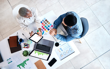 Image showing Top view, business people and laptop for web design at desk with teamwork, blank tablet and marketing. Man, woman and planning for ux with chart, data analytics and collaboration at tech startup