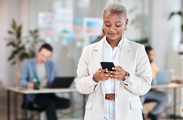 Image showing Phone, business and black woman typing, happy and social media in company. Smartphone, networking and African professional reading email, message and news on internet, app or texting online in office