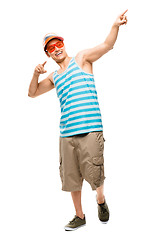 Image showing Pointing fun, man and happy with party clothing and smile with silly glasses. Young male person, show off and isolated on transparent, png background with casual cool fashion and trendy style