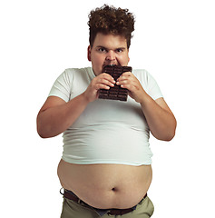 Image showing Plus size, portrait of a man eating a chocolate and isolated against a transparent png background. Mental health or stress, addiction or hungry and male person eat candy bar for greedy unhealthy diet