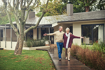 Image showing Happy senior couple, garden and walk with smile, hug and together with love, bonding and freedom in winter. Old woman, happy man and embrace in backyard in retirement, nature and outdoor in morning