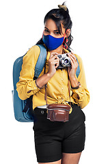 Image showing Camera, photographer and woman with a mask, travel and portrait isolated on a transparent background. Female person, traveler and tourist in a pandemic for memory, tourism and photography in png