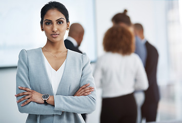 Image showing I will achieve all of my goals. Portrait of a young businesswoman in the office with her colleagues in the background.