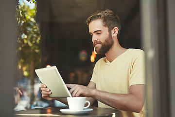 Image showing Coffee shop, tablet and man typing, scroll or working on freelance blog, online review or cafe feedback. Ecommerce, remote work and small business owner, customer or person check restaurant media