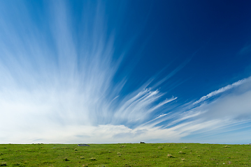 Image showing Blue sky with clouds stretching towards the sky