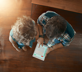 Image showing Teamwork, collaboration or employees with tablet reading online report in meeting for analysis in top view. Statistics data analysis, screen or above of man and woman checking stats in startup office