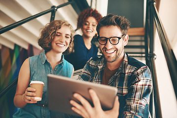 Image showing Teamwork, designers or happy people with tablet or online report in meeting for analysis on steps. Smile, internet or group of creative employees in startup modern office on stairs for a digital news