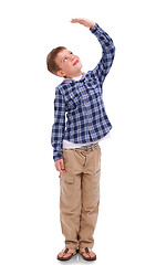 Image showing Isolated boy kid, check height and smile for growth, development and thinking by png background. Male child model, young and happy with hand for measuring, think and childhood wish with kids fashion