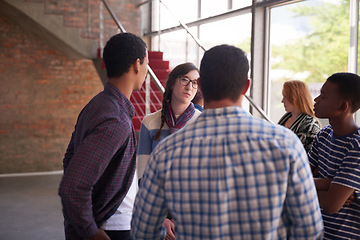 Image showing Catching up between their breaks. Cropped shot of a group of university students hanging out between class.