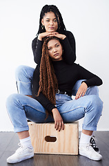 Image showing They love being fashionable together. Studio shot of two beautiful young women posing against a grey background.