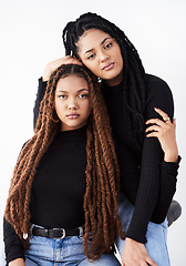 Image showing Together they inspire beauty. Studio shot of two beautiful young women posing against a grey background.