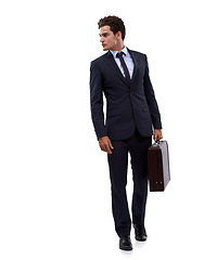 Image showing Always on his tiptoes. A young businessman carrying his suitcase.