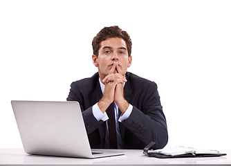 Image showing Managing his diary. A pensive young businessman sitting in front of his laptop.