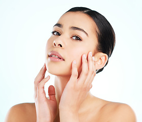 Image showing Face, beauty skincare and woman in studio isolated on a white background. Portrait, natural aesthetic and serious female model with makeup, cosmetics and facial treatment, healthy skin and wellness.