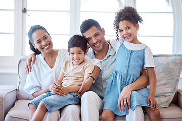 Image showing Parents, kids and portrait on sofa with smile, hug and together with support, love and care in lounge. Young family, children and happy on living room couch with bonding, siblings and relax in house