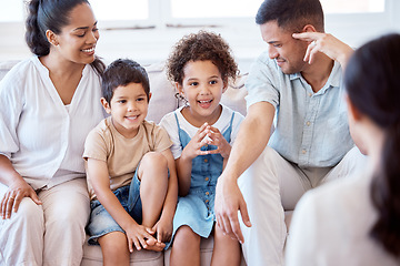 Image showing Parents, kids and counselling with psychology, smile and together on sofa, support and discussion. Young family, children and happy on couch with psychologist, listening and talking for mental health