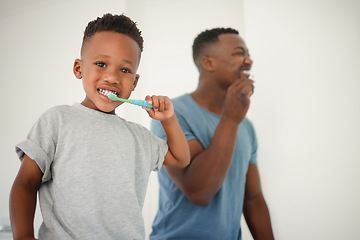 Image showing African father, bathroom and brushing teeth with son, care or love for cleaning, hygiene or dental health. Black man, boy and toothbrush in family house for portrait, smile or clean mouth in morning