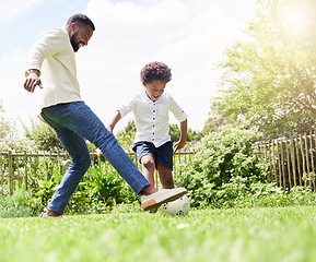 Image showing Soccer, dad and happy kid on a garden with exercise, sport learning and goal kick together. Lawn, fun game and black family with football on grass with youth, sports development and bonding on field