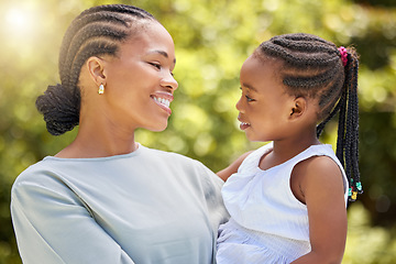 Image showing Love, happy and mother with daughter in nature for bonding, free time and smile. Happiness, spring and care with black woman holding young girl in outdoor park for weekend, relax and family