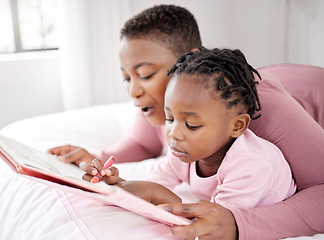 Image showing Love, reading book and mother with child in bed for learning, drawing and fun at home. Storytelling, family and parent with girl in bedroom with notebook for literature, art or writing in their house