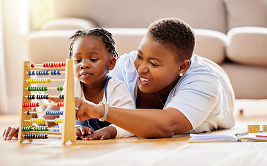 Image showing Learning, help and abacus with mother and daughter in living room for math, education and homeschooling. Numbers, support and study with black woman and girl in family home for teaching and knowledge