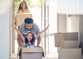 Image showing Happy family, boxes and child playing in new home with smile, excitement and mortgage on property investment. Man, woman and girl in box in house, moving and investing in real estate, love and future