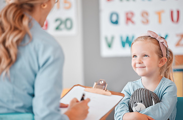 Image showing Girl child, psychologist and writing with notes, smile and listening for support, help and school counselling program. Woman, female kid and conversation for mental health, psychology and wellness