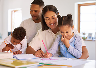 Image showing Family, parents help their children with homework and books on desk at their home. Support with writing or reading, education or learning and woman with man helping their kids color in a book