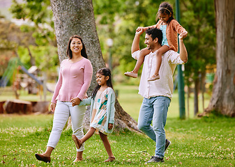 Image showing Walking, piggyback and happy family in a park, talking and bonding with love, smile and fun in nature. Children, parents and conversation in forest together on weekend, cheerful and enjoying freedom