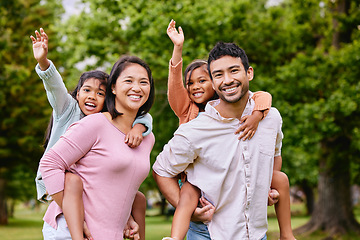 Image showing Piggyback, portrait and happy asian family in a park with love, smile and games in nature. Face, freedom and parents carrying children in a forest, bonding and playing together on the weekend