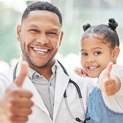 Image showing Doctor, child and thumbs up together for health care in hospital with a smile at a consultation. Face of black man or pediatrician and girl patient for medical check, family insurance or development