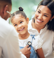 Image showing Happy, doctor and mother with girl, healthcare checkup and listen to heartbeat, friendly or consultation. Physician, mama or daughter in the hospital, appointment or stethoscope for diagnosis or care