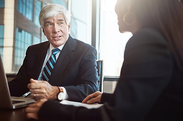 Image showing Exchanging business information. Cropped shot of two businesspeople working together in the boardroom.