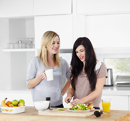 Image showing Kitchen, friends and vegan women with salad for healthy eating, meal and lunch together at home. Food, nutrition and happy female people smile with drink and vegetables for diet, wellness and detox