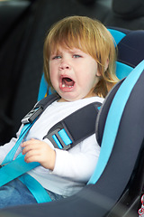 Image showing Sad, crying and portrait of baby in car seat for fear, uncomfortable and travel safety. Security, transportation and journey with upset toddler for vacation trip, frustrated and protection