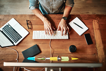 Image showing Top view, computer and business man typing for planning, strategy and online data analysis at office desk. Hands of worker, desktop and keyboard for tech, research and productivity in startup agency