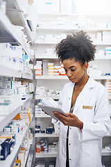 Image showing I have the right tools to keep my pharmacy under control. Cropped shot of a pharmacist using a digital tablet in a chemist.