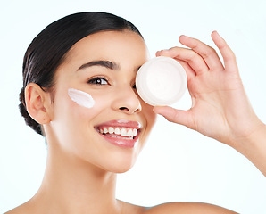 Image showing Face, skincare and woman with cream container in studio isolated on a white background. Portrait, dermatology product and happy female model with beauty cosmetics, creme or lotion for healthy skin.