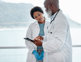Image showing African doctors, teamwork and talking with tablet, data analysis or results for healthcare in hospital. Senior black man, woman and medical discussion with digital touchscreen for wellness in clinic