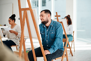 Image showing Art is a form of expression. Cropped shot of a diverse group of artists sitting together and painting during an art class in a studio.