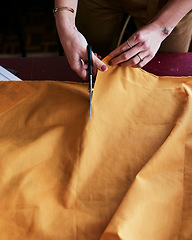 Image showing Lets give this piece of fabric some life. Cropped shot of an unrecognizable fashion designer cutting fabric.
