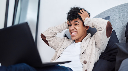 Image showing Just when you thought 2020 couldnt get any crazier. Shot of a young man looking shocked while using a laptop on his bed at home.