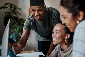 Image showing Taking on company growth with teamwork. Shot of a group of young businesspeople using a computer together in a modern office.